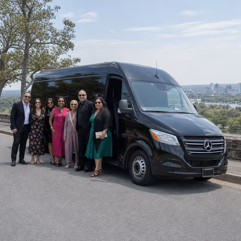 Group beside a Mercedes Sprinter limo from the Little Rock fleet