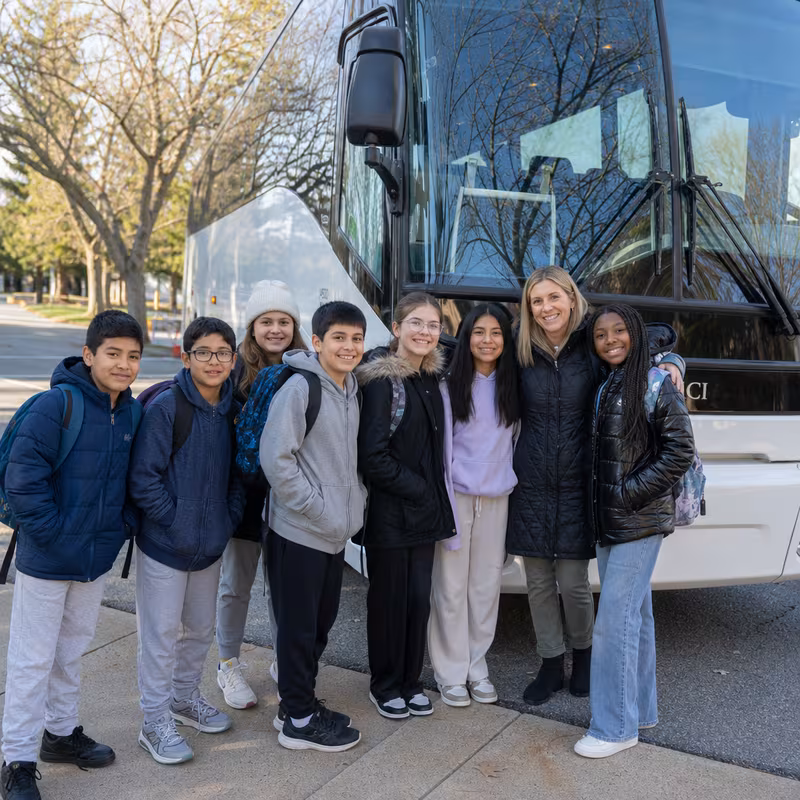 Passengers loading luggage while boarding an Little Rock group shuttle
