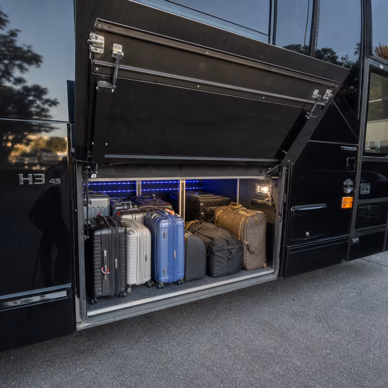 Party bus interior with wraparound leather seating and LED lighting in Little Rock