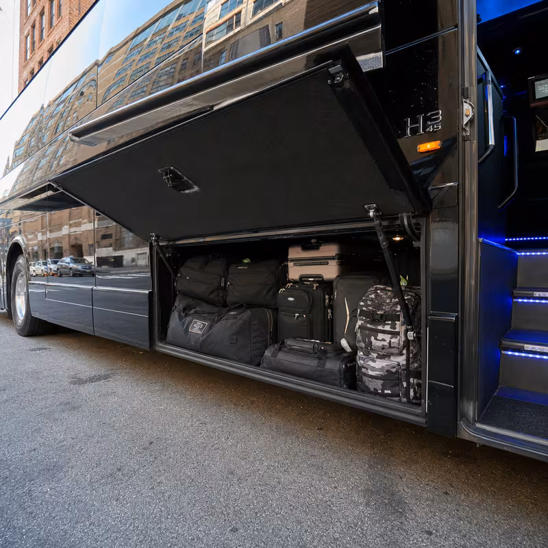 Party bus interior with wraparound leather seating and LED lighting in Little Rock
